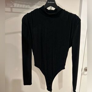 Jlux label black high neck bodysuit. Never worn. No stains or odor. Final sale